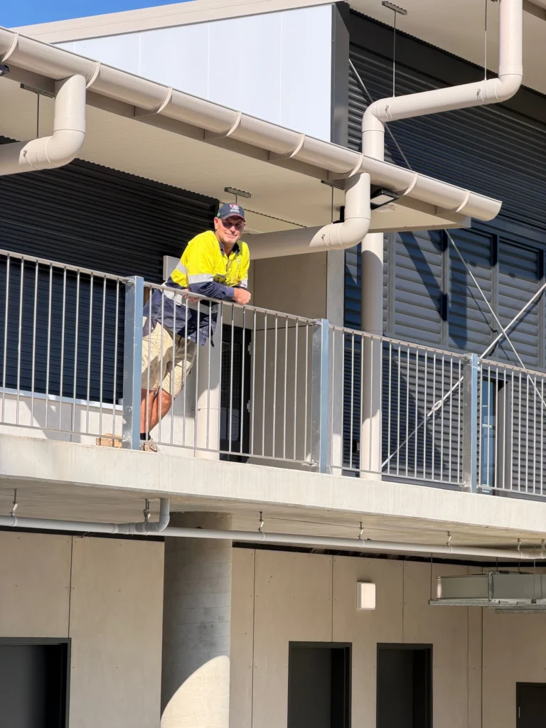 Electrician inspecting overhead services at Bega Sports Complex