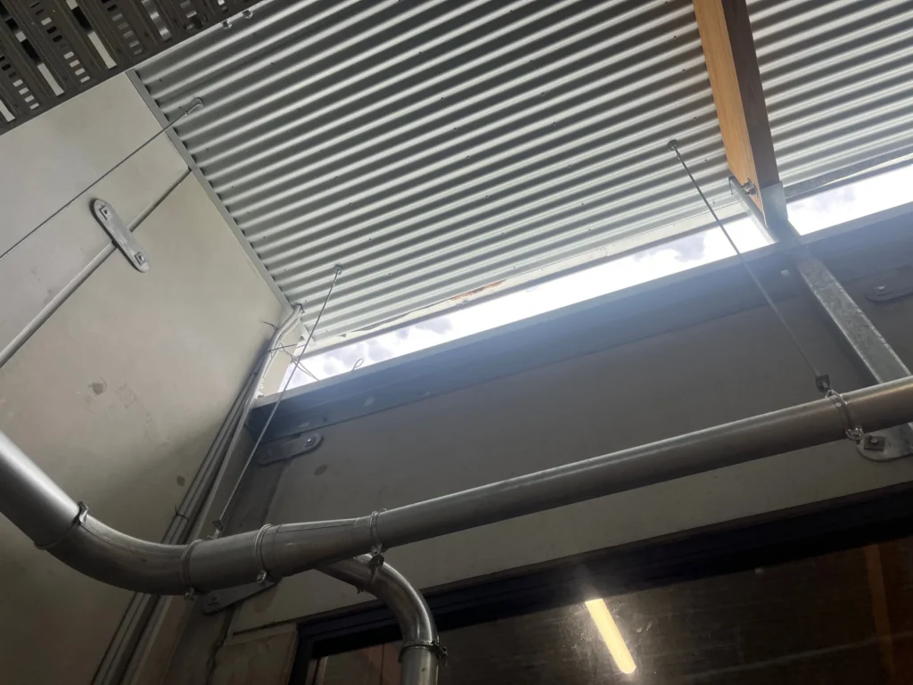 Ceiling structure and services inside Carroll College hall