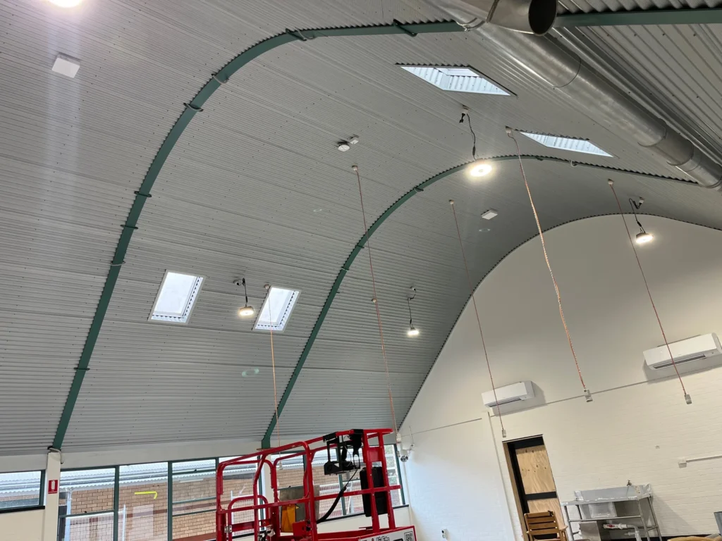Curved ceiling and suspended lighting during Carroll College fitout