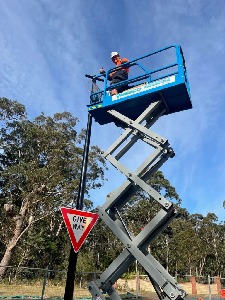 Electrician on an elevated work platform at Carroll College