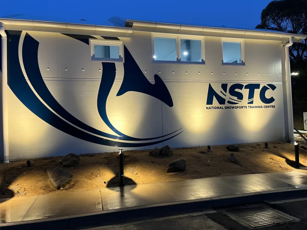 National Snowsports Training Centre exterior signage at night