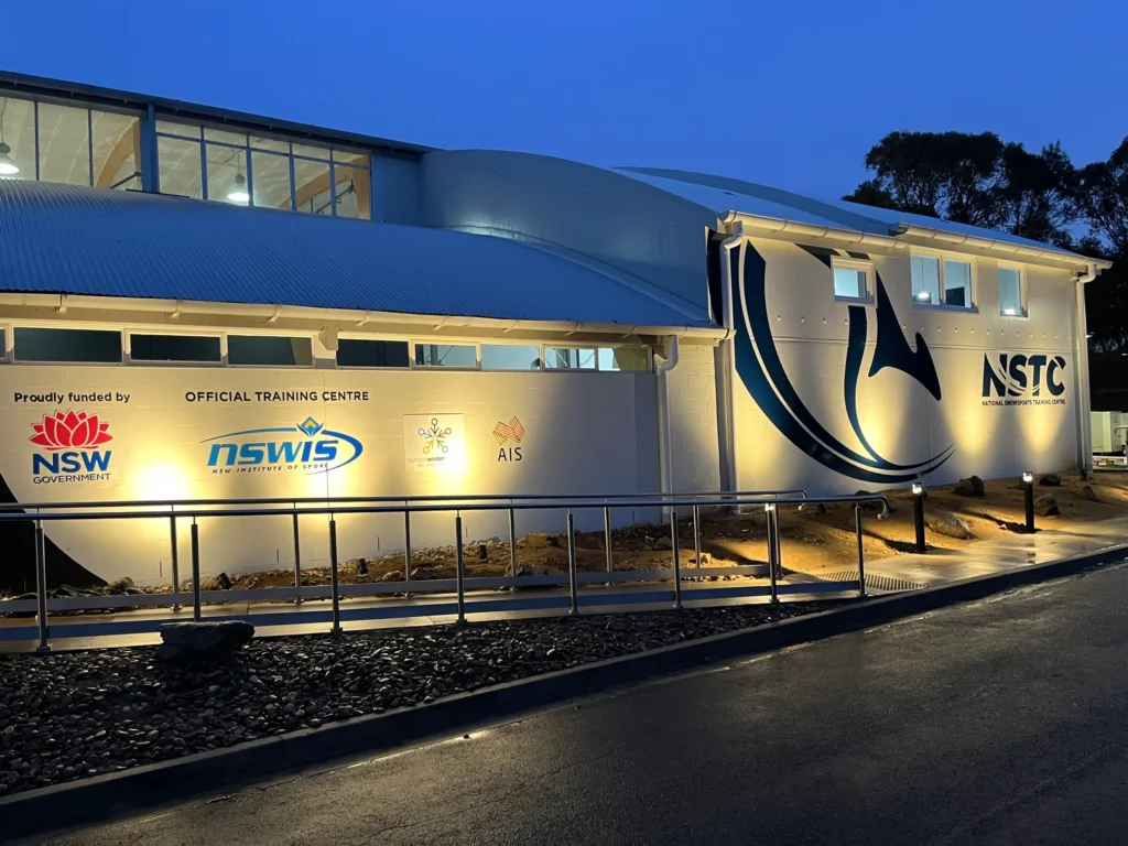 National Snowsports Training Centre exterior at dusk
