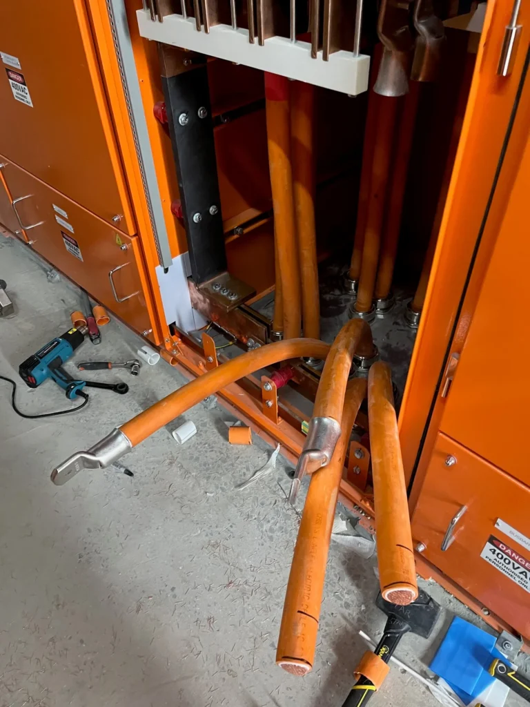 Submain cables at the base of an open hospital switchboard