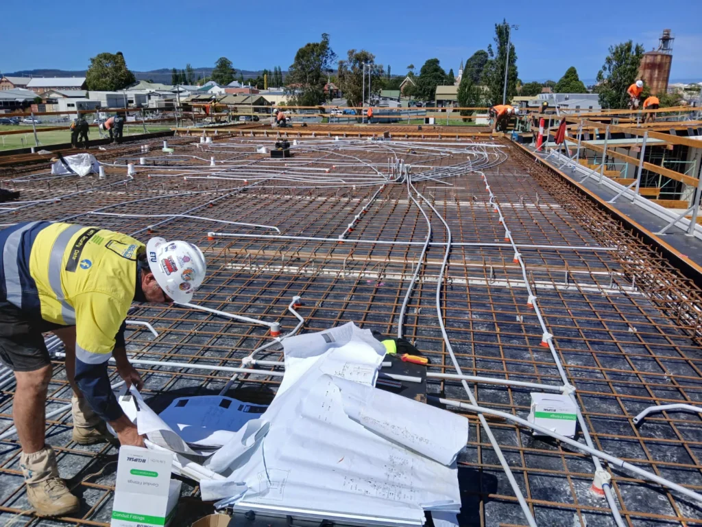 Electrical conduits laid across slab reinforcement at Bega Sports Complex