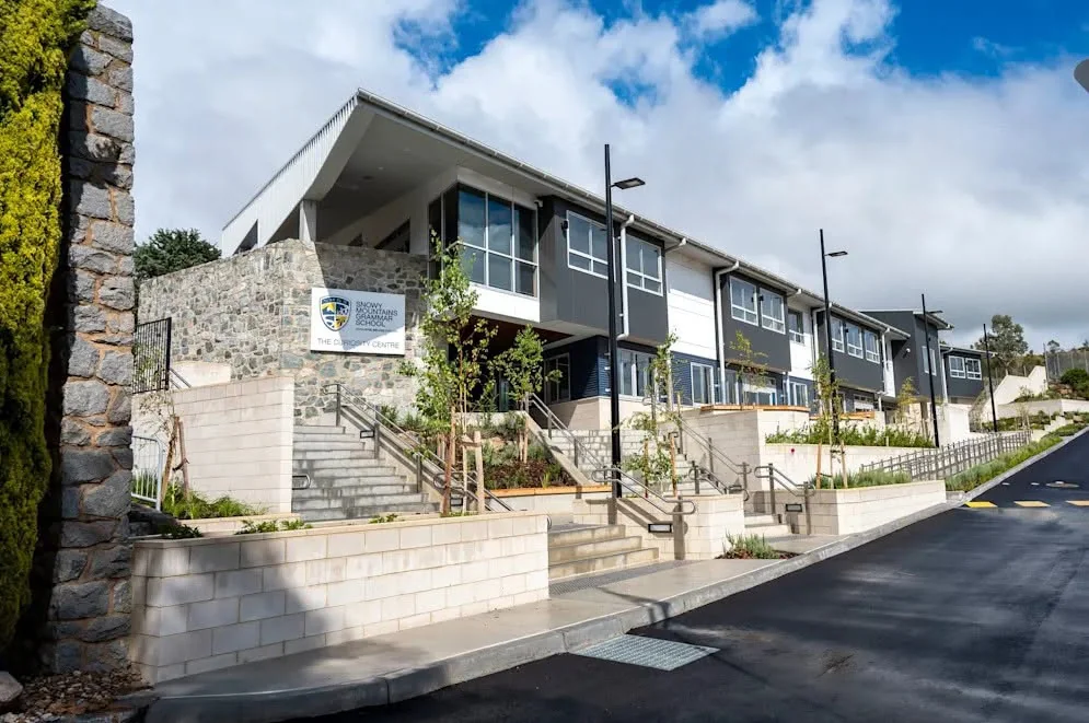 Snowy Mountains Grammar school building with stone entrance and exterior stairs